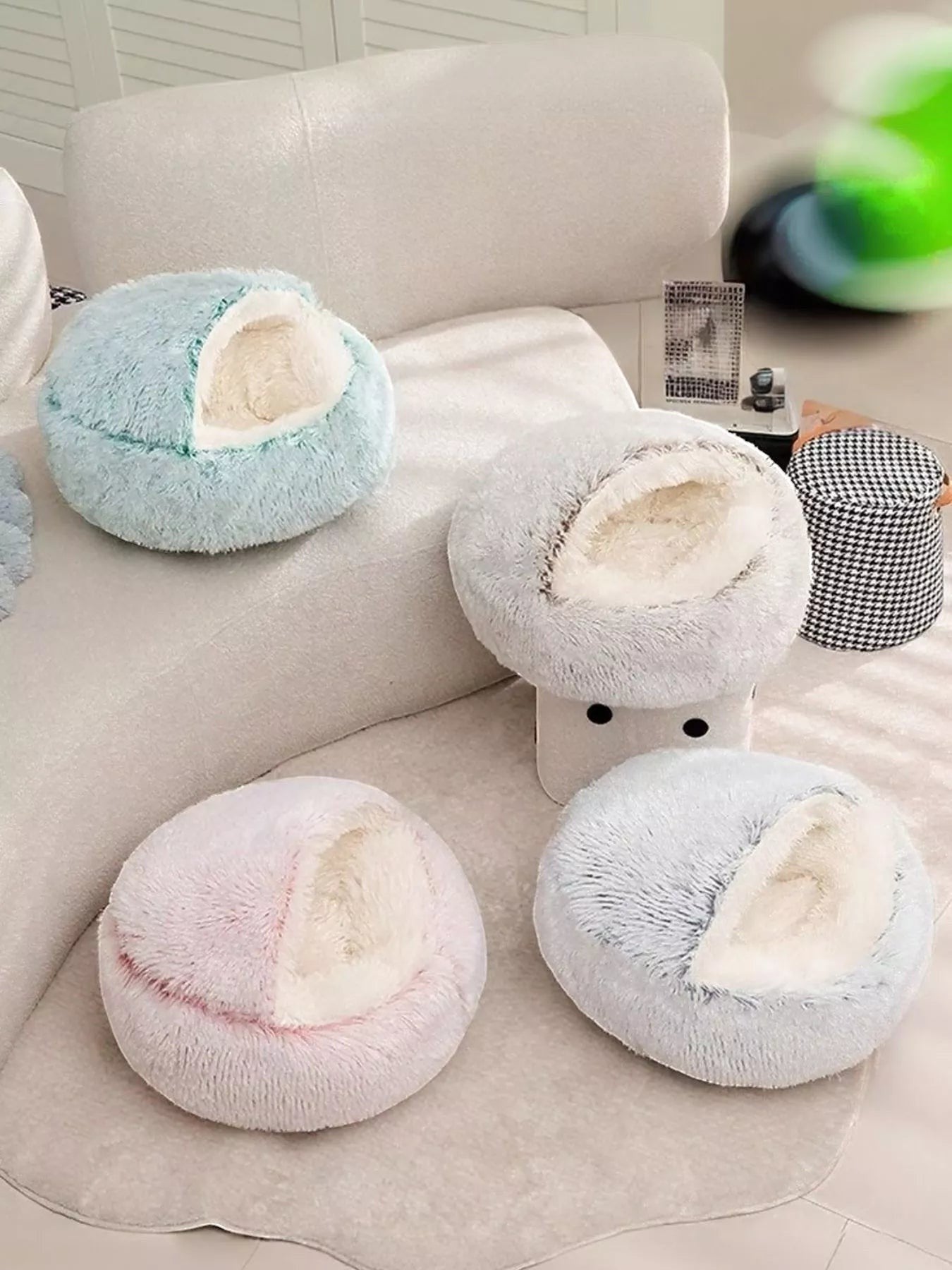 Little Pets Club Calming Cloud Nest pet bed in light blue, pink, and grey faux fur. Deep, round design with raised rim for support.