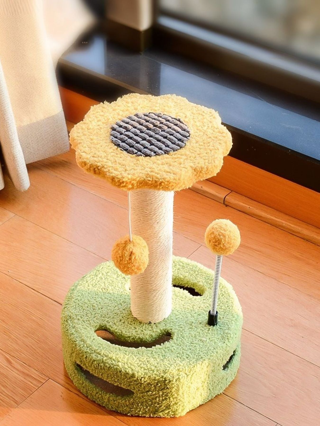 Little Pets Club Bloom Cat Scratcher: green plush base, sisal post, yellow flower top, dangling pom balls. Encourages scratching and play.