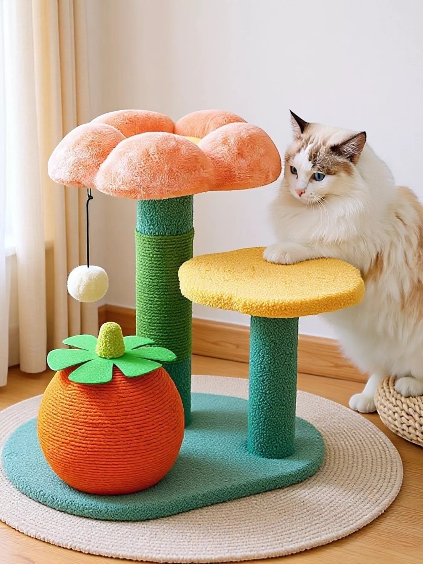 Little Pets Club Bloom cat tree with orange fruit base, green sisal posts, and peach plush flower perch. Features a hanging pom-pom toy.