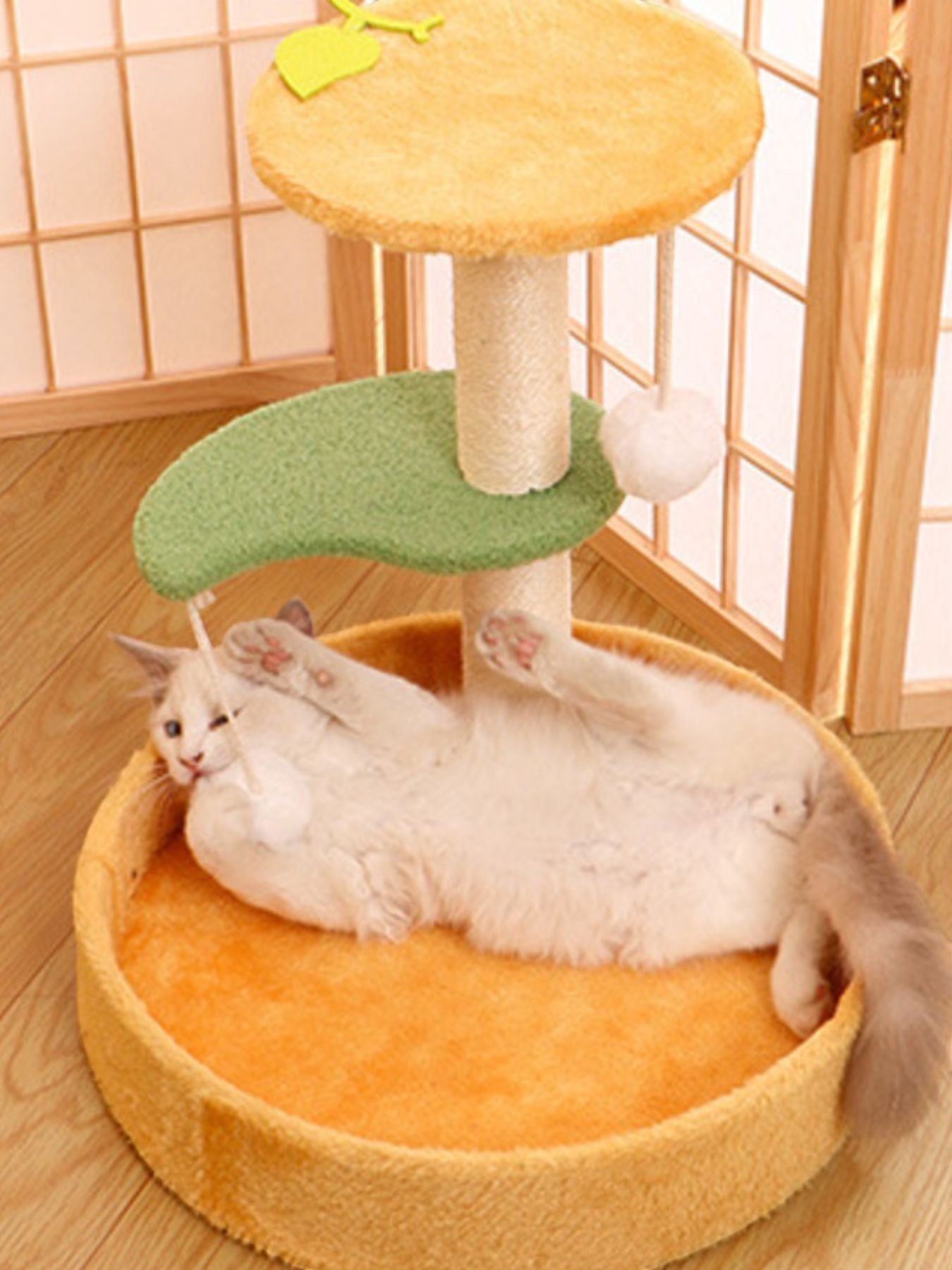 Little Pets Club Playhouse Scratcher cat tree with yellow perch, green platform, and orange bed. A white cat lounges in the bed.