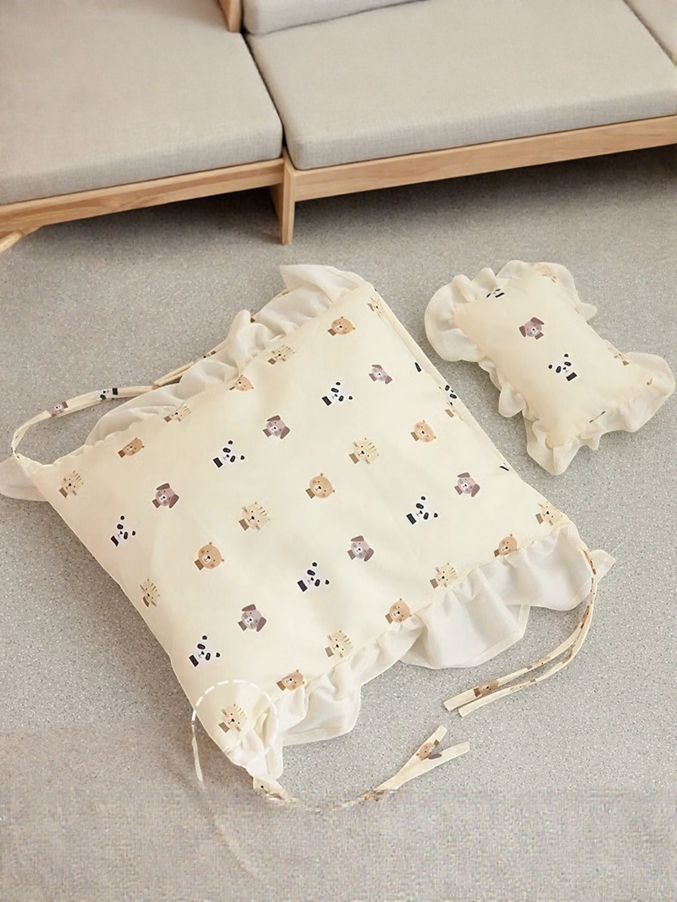 Little Pets Club cream pet bed with cute bear and panda pattern, ruffled edges, and matching pillow.