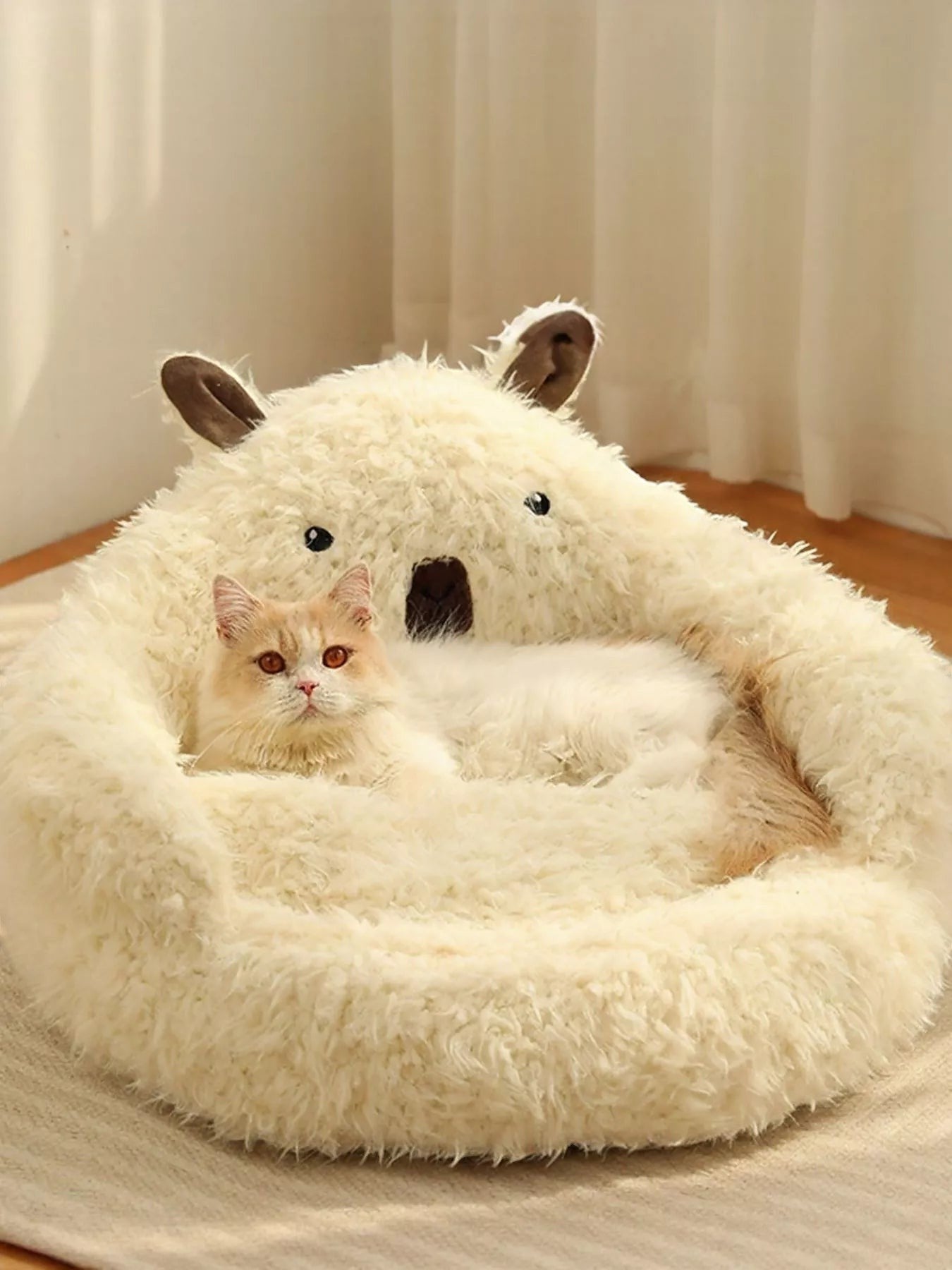 Little Pets Club cream plush bear-shaped pet bed with raised edges and a fluffy interior, featuring a cream cat resting inside.