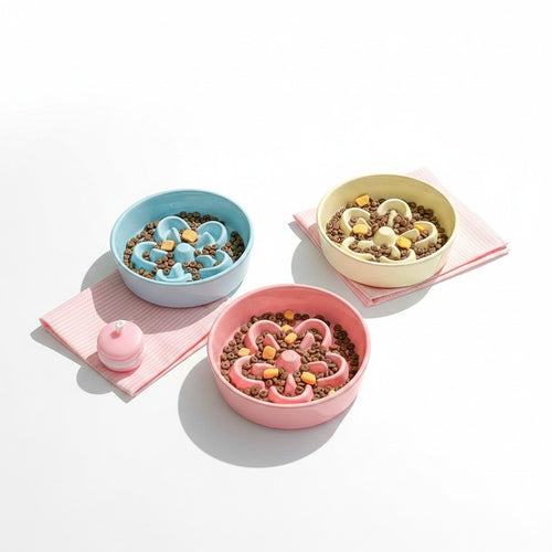 Little Pets Club flower-shaped ceramic slow feeder pet bowl in pink, blue, and cream colors, designed to prevent fast eating.