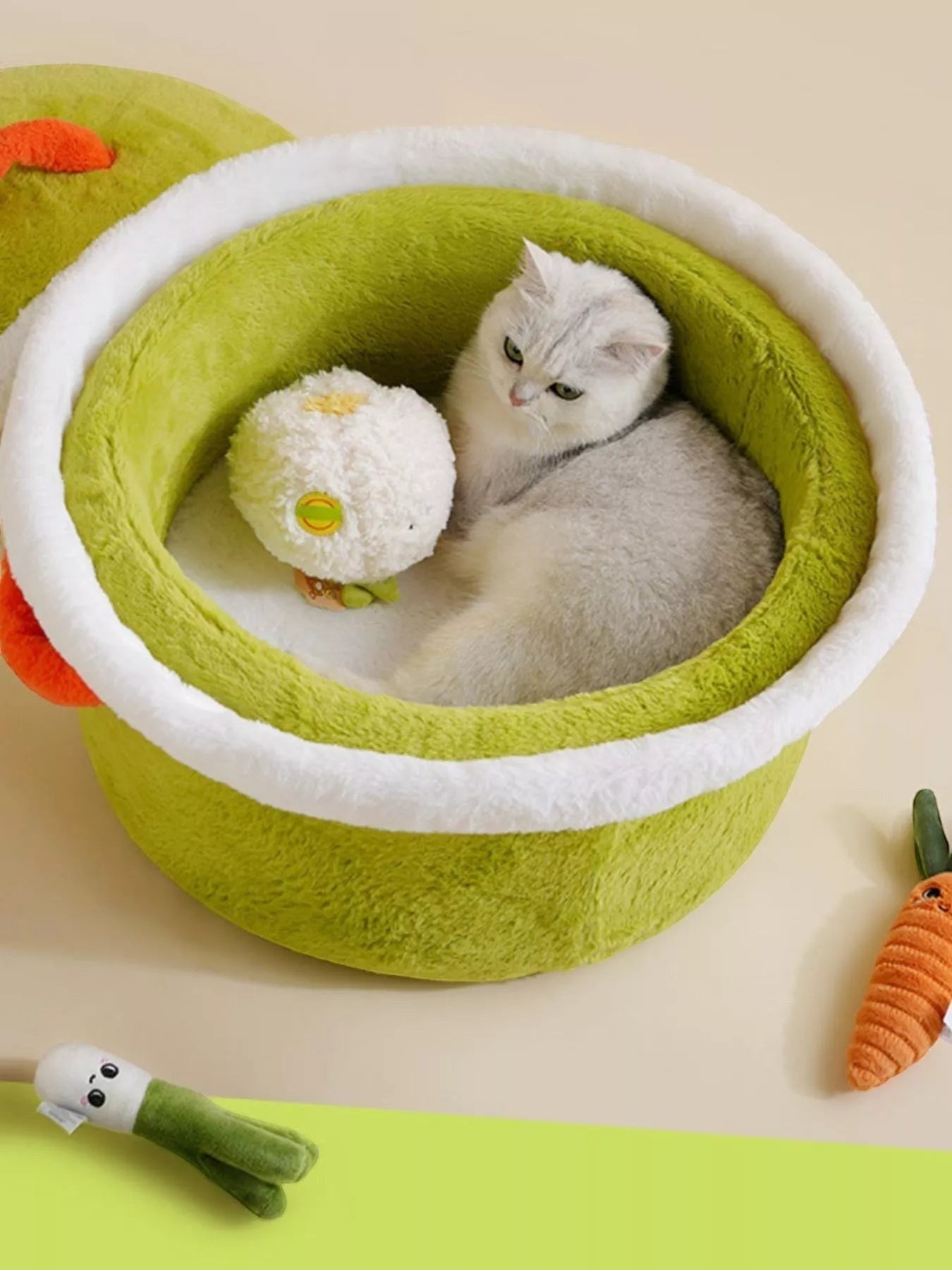 little pets club green plush pet cave bed with white trim and a white plush toy inside, featuring a cat.
