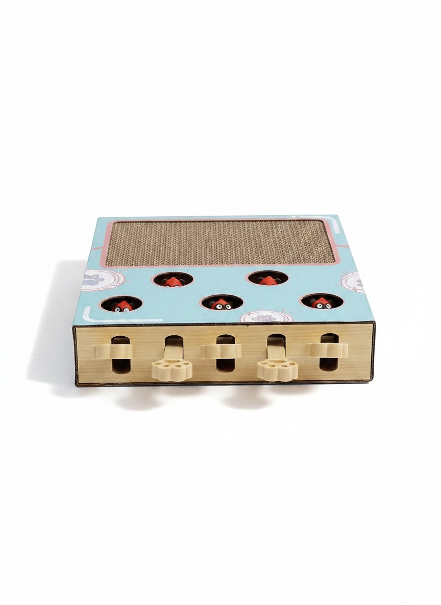 Little Pets Club interactive cat scratching box with whack-a-mole game, featuring corrugated cardboard and playful peek-a-boo characters.