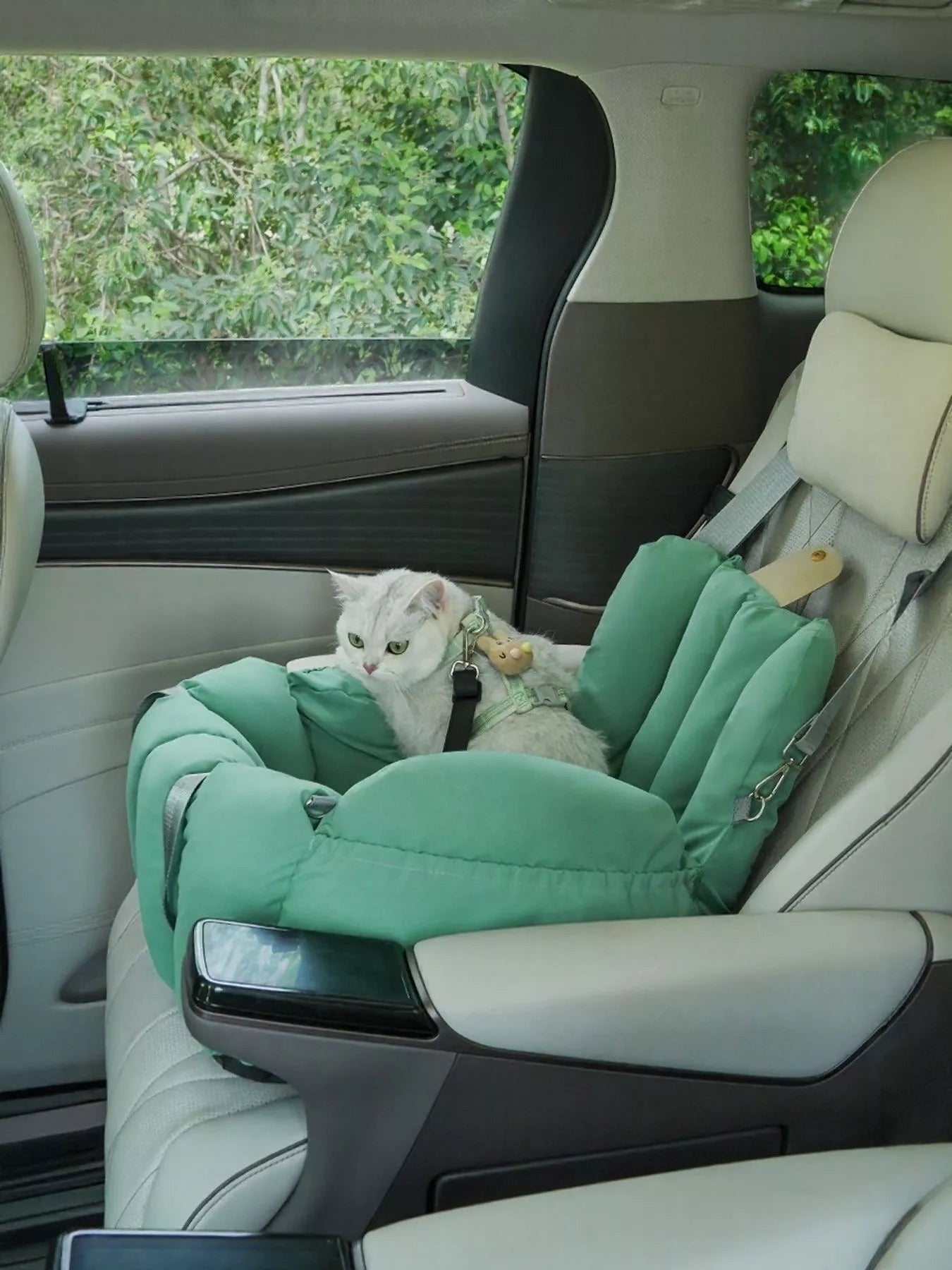 Little Pets Club mint green convertible pet travel tote and car seat with a white cat inside.