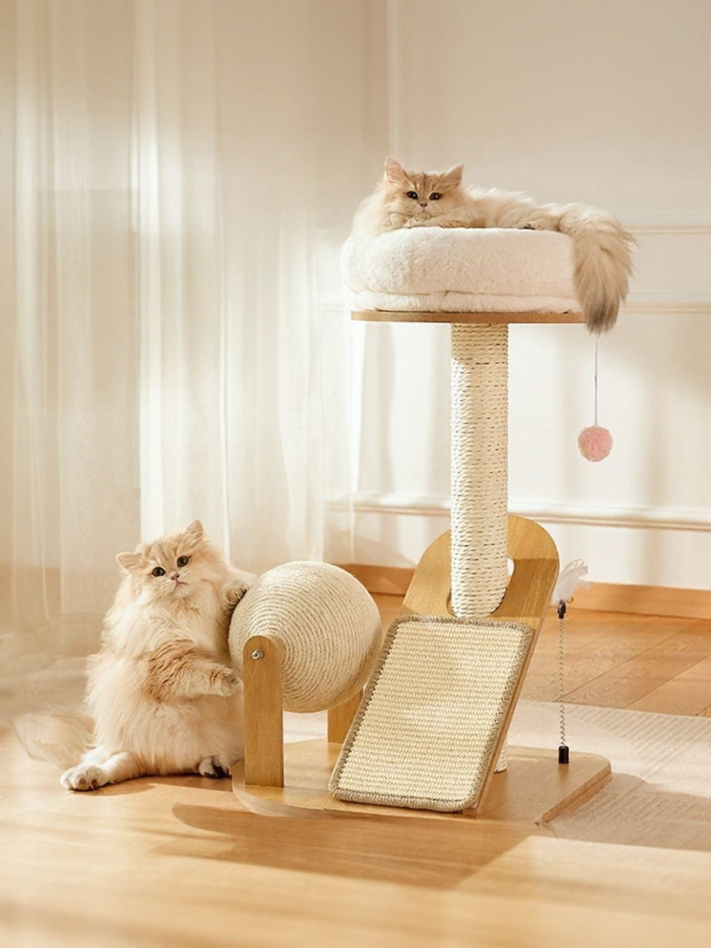 Little Pets Club modern wood cat tower with plush bed, sisal scratching post, and rolling scratch drum. Two cats interact with the tower.