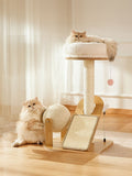 Little Pets Club modern wood cat tower with plush bed, sisal scratching post, and rolling scratch drum. Two cats interact with the tower.