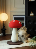 Little Pets Club mushroom cat scratching post with red cap and white spots, natural fiber stem, and a fluffy cat playing.