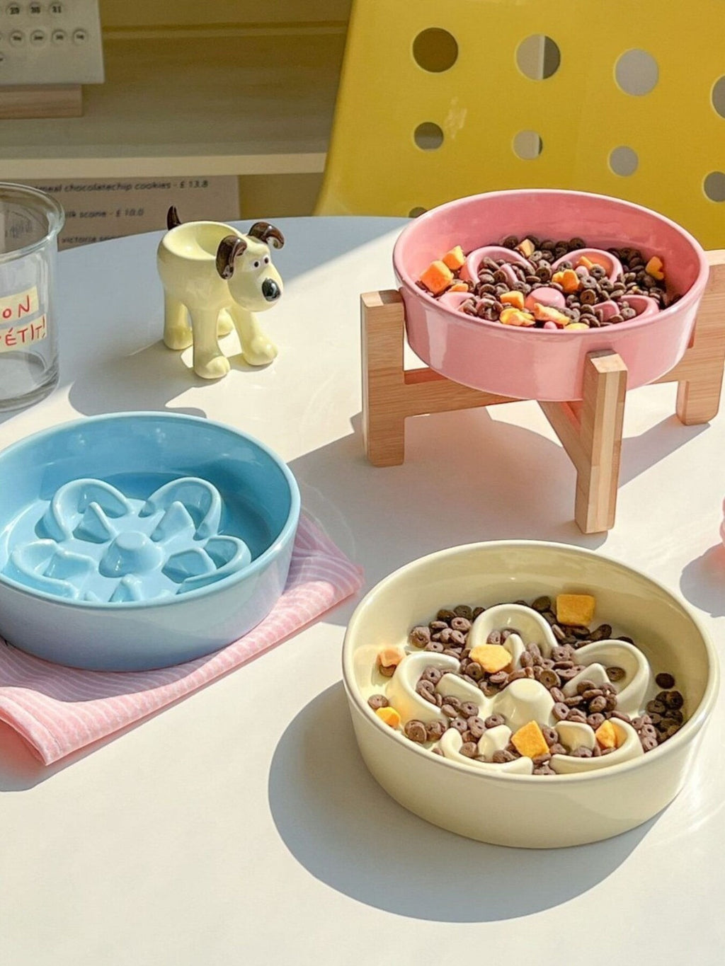Little Pets Club pastel ceramic flower slow feeder pet bowl for cats and small dogs. Available in blue, pink, and cream.