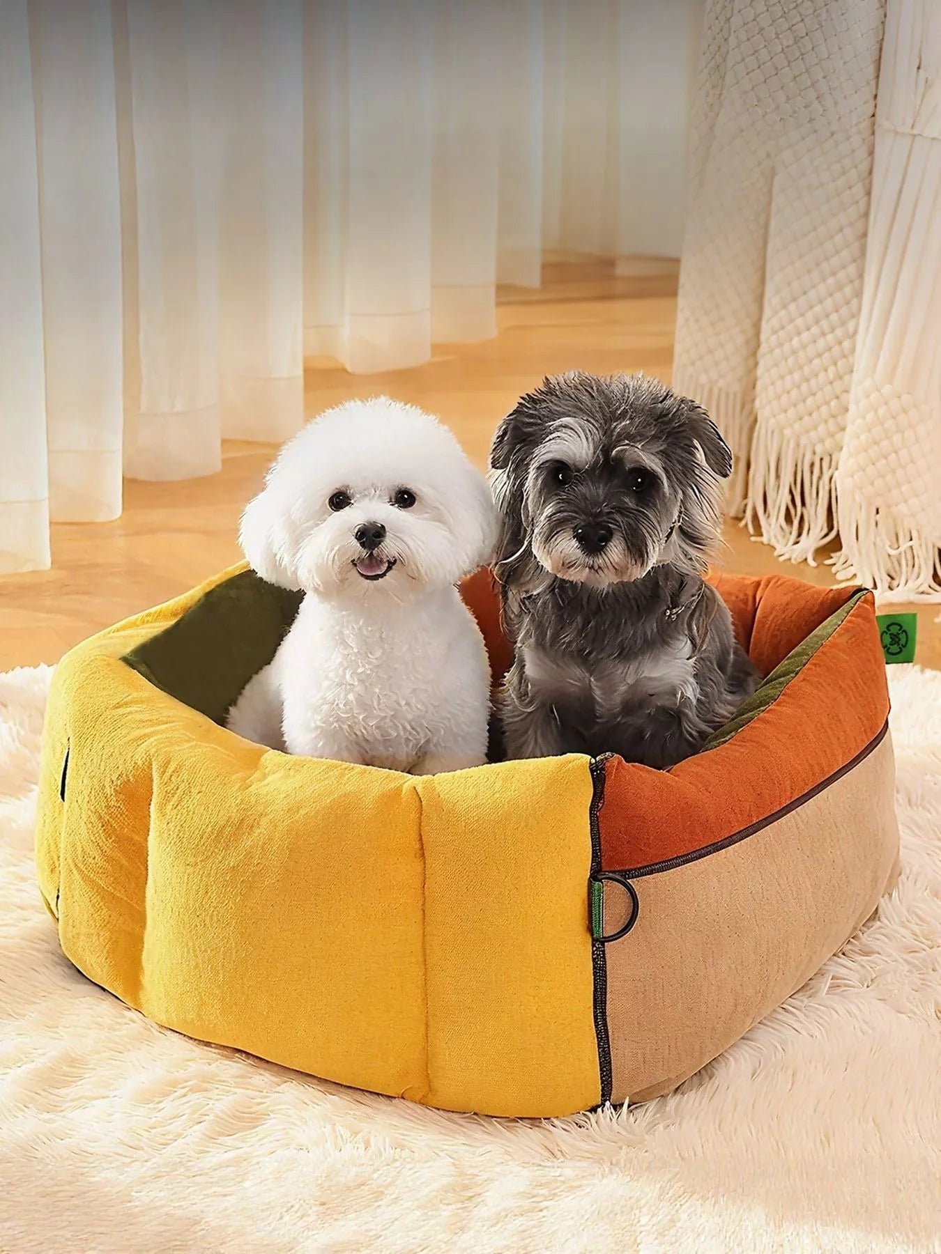 Little Pets Club yellow and tan pet car seat bed with two small dogs inside, suitable for cats up to 27.5 lbs and dogs up to 22 lbs.