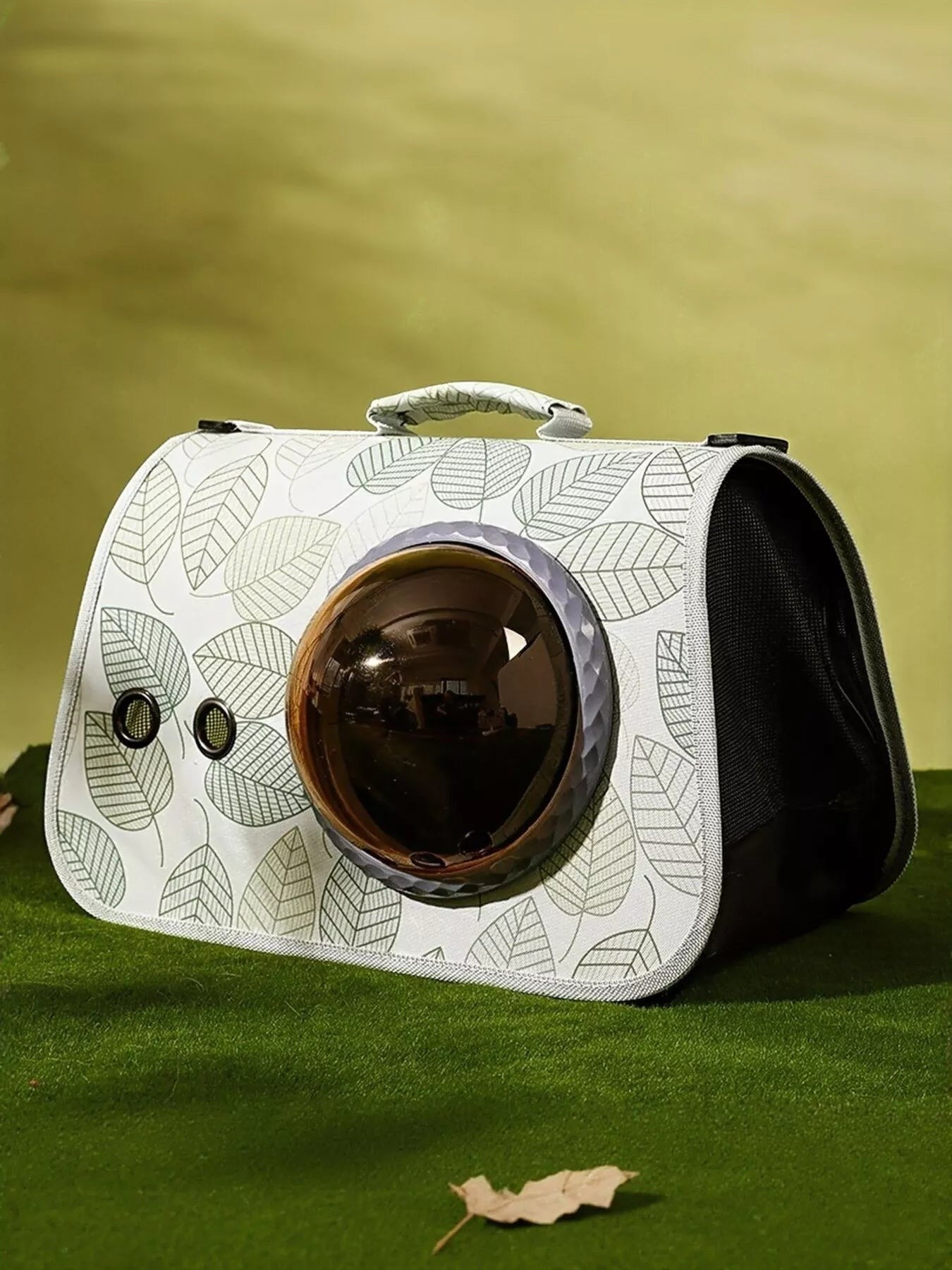 Little Pets Club white pet carrier with green leaf pattern and a brown bubble window for pet visibility.