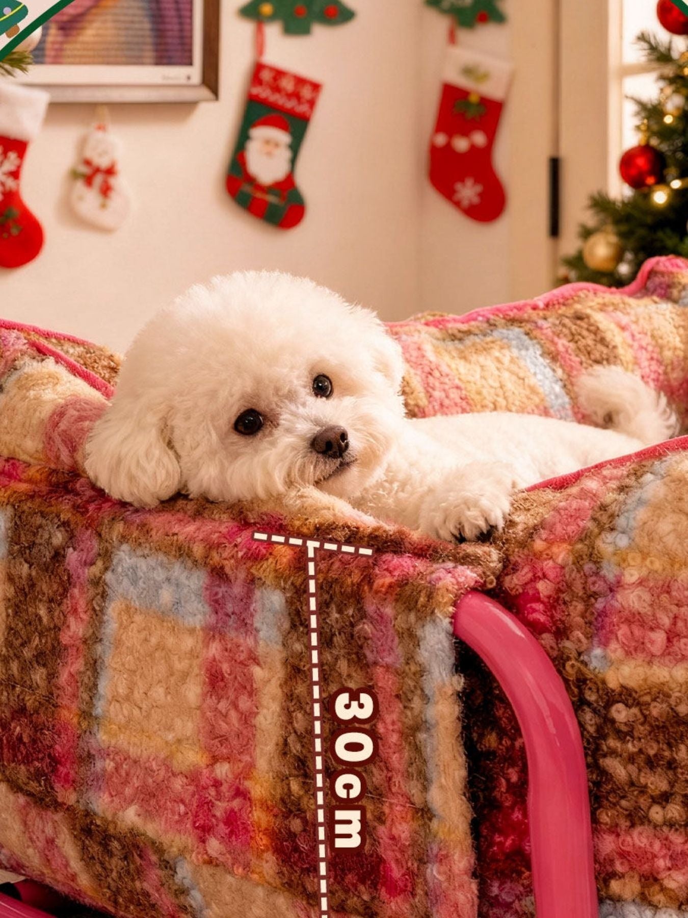 Little Pets Club Retro Plaid Snuggle Sofa for pets, featuring a soft plush fabric in pink, brown, and tan plaid with raised sides for security. A small white dog rests comfortably on the bed.