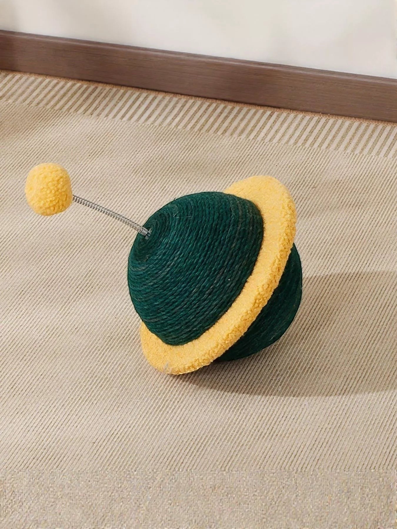 Little Pets Club green planet cat toy with yellow ring and yellow pom pom on a spring.
