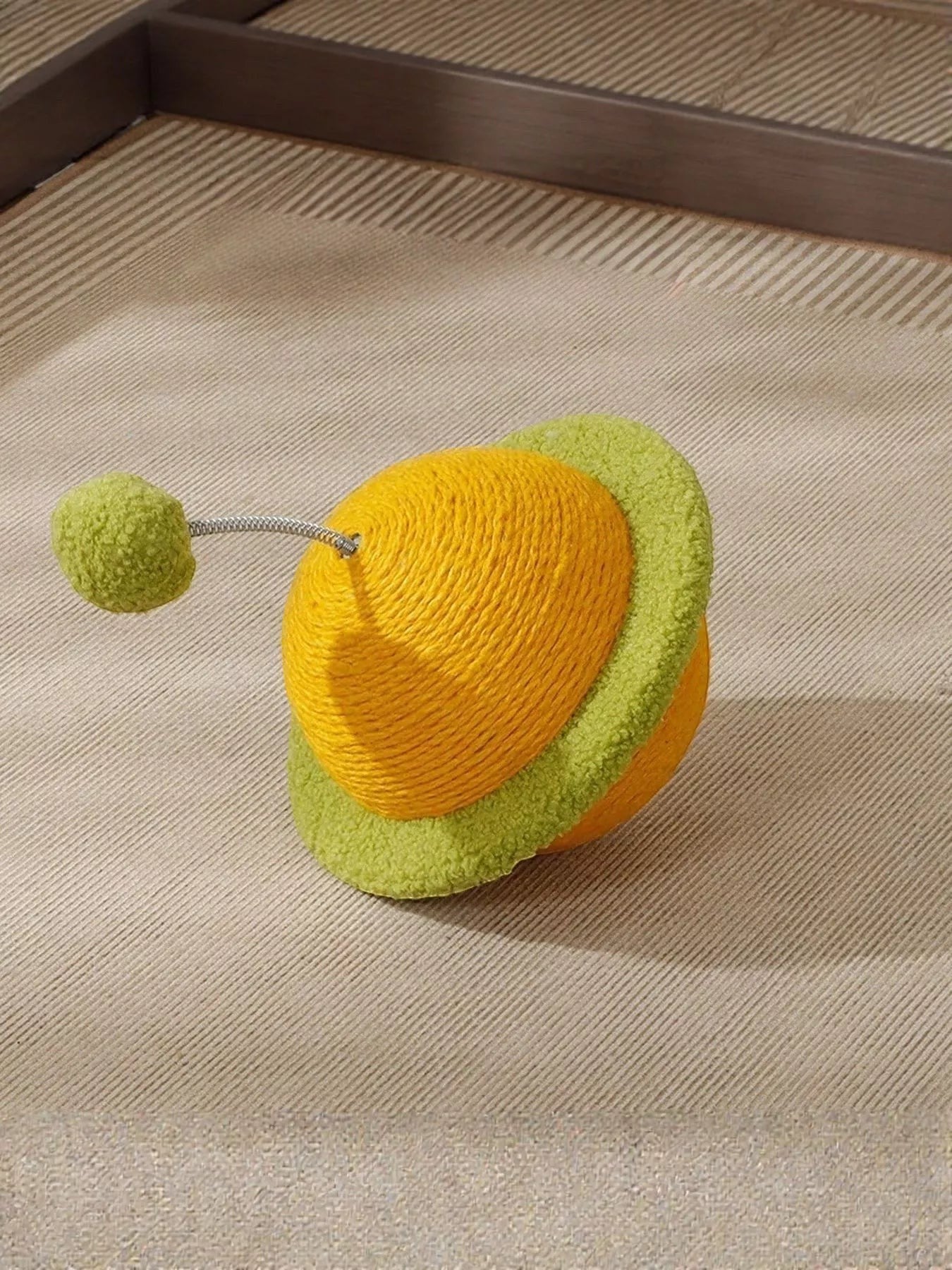 Little Pets Club yellow planet cat toy with green fuzzy rings and a green pom pom on a spring.