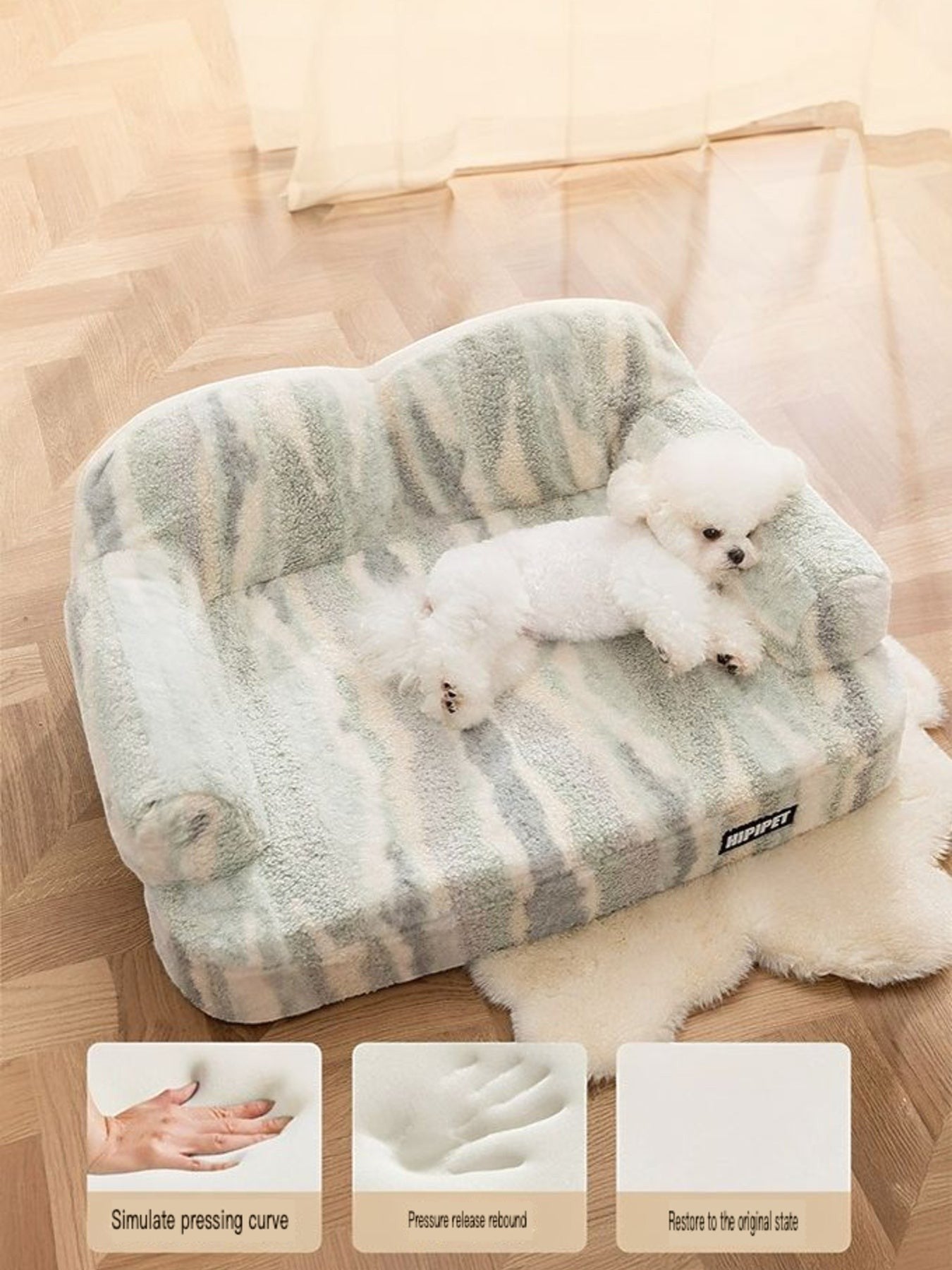 Little Pets Club plush pet sofa bed in light green and grey camouflage pattern with raised bolsters and a white bichon frise resting on it.