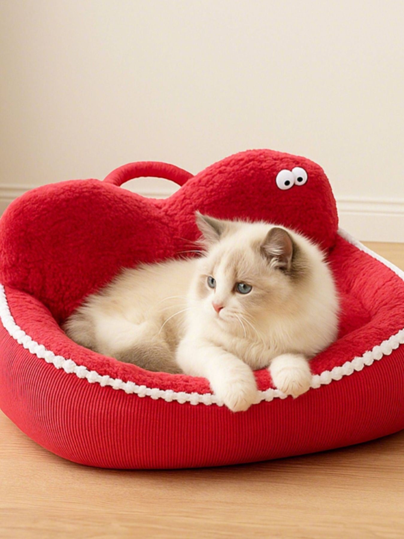 Little Pets Club red plush orthopedic pet sofa bed with raised edges and a white trim, featuring a fluffy cat.