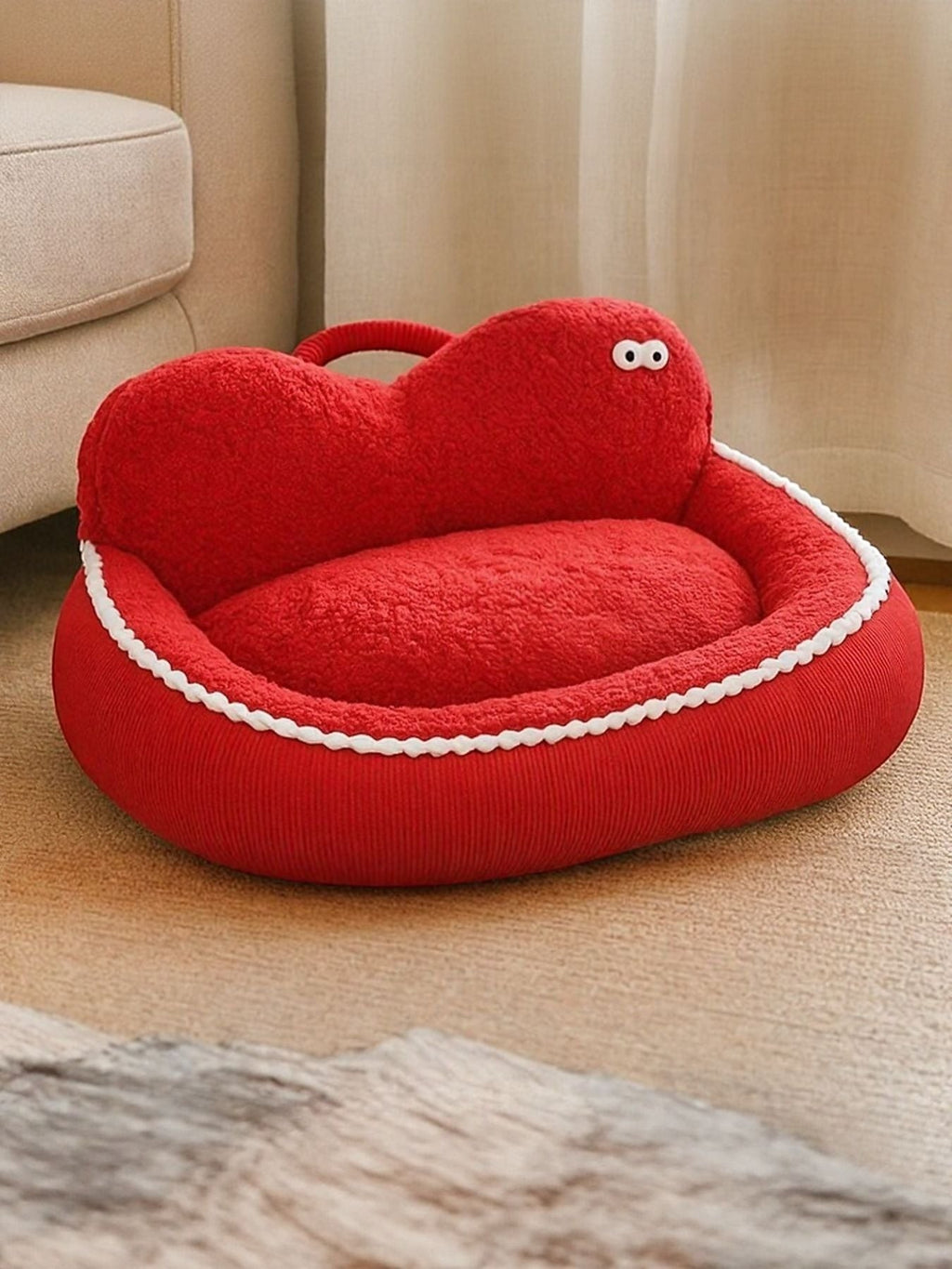 Little Pets Club red plush orthopedic pet sofa bed with raised edges and cute googly eyes.