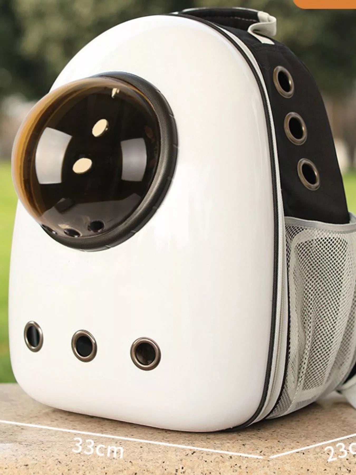 Little Pets Club white and black space capsule pet carrier backpack with transparent dome and mesh side pockets.