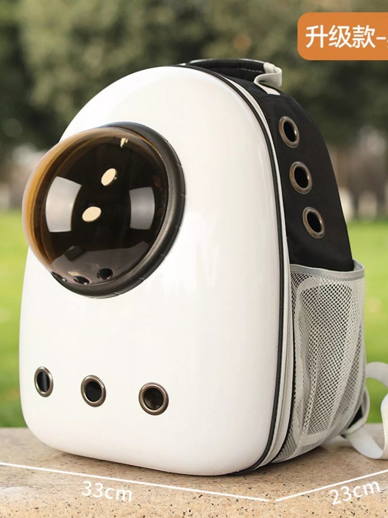 Little Pets Club white and black space capsule pet carrier backpack with transparent dome window and mesh side pockets.