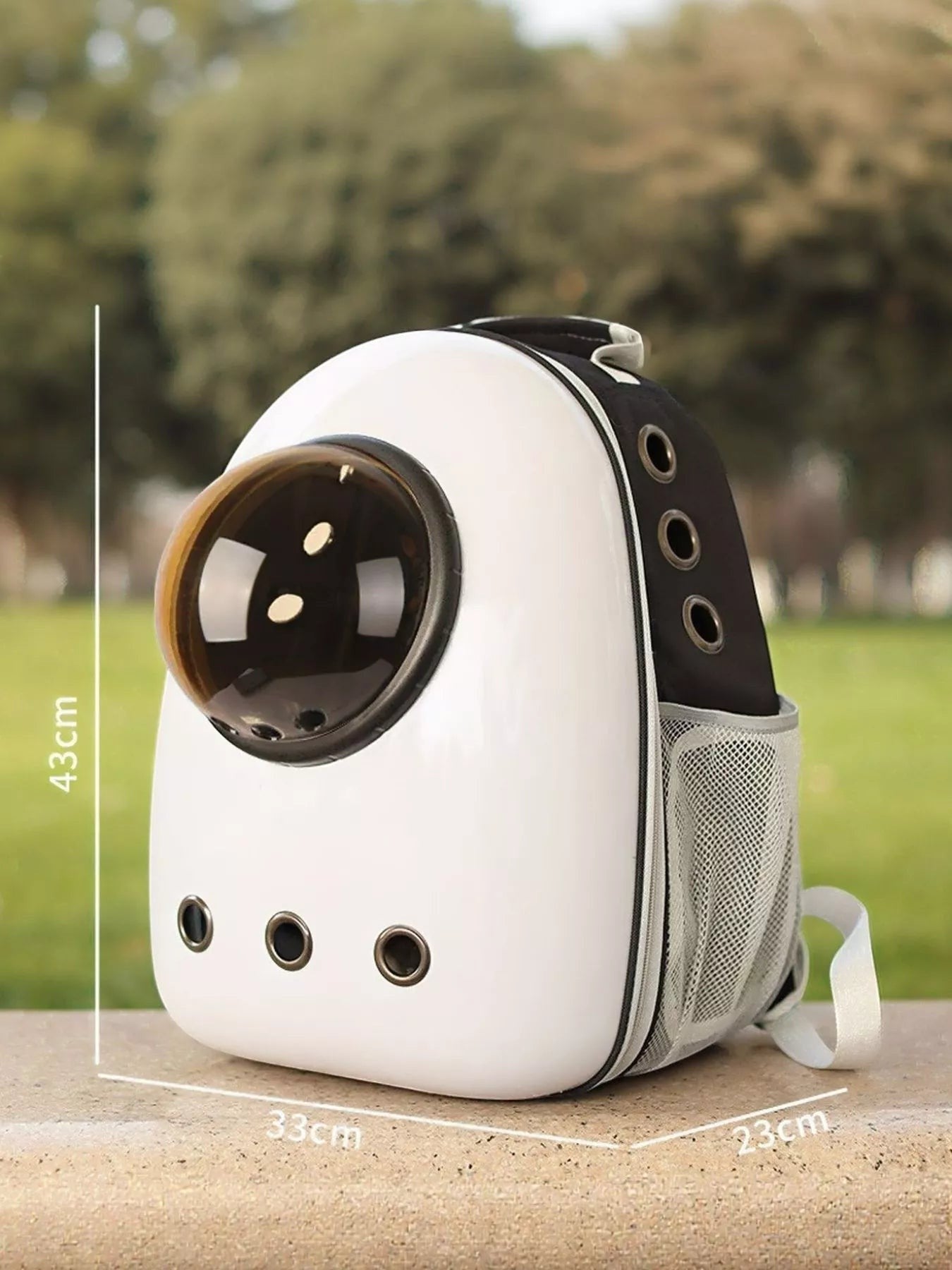 Little Pets Club white and black space capsule pet carrier backpack with transparent dome and mesh side pockets. Measures 16.9" H x 13" W x 9.1" D.