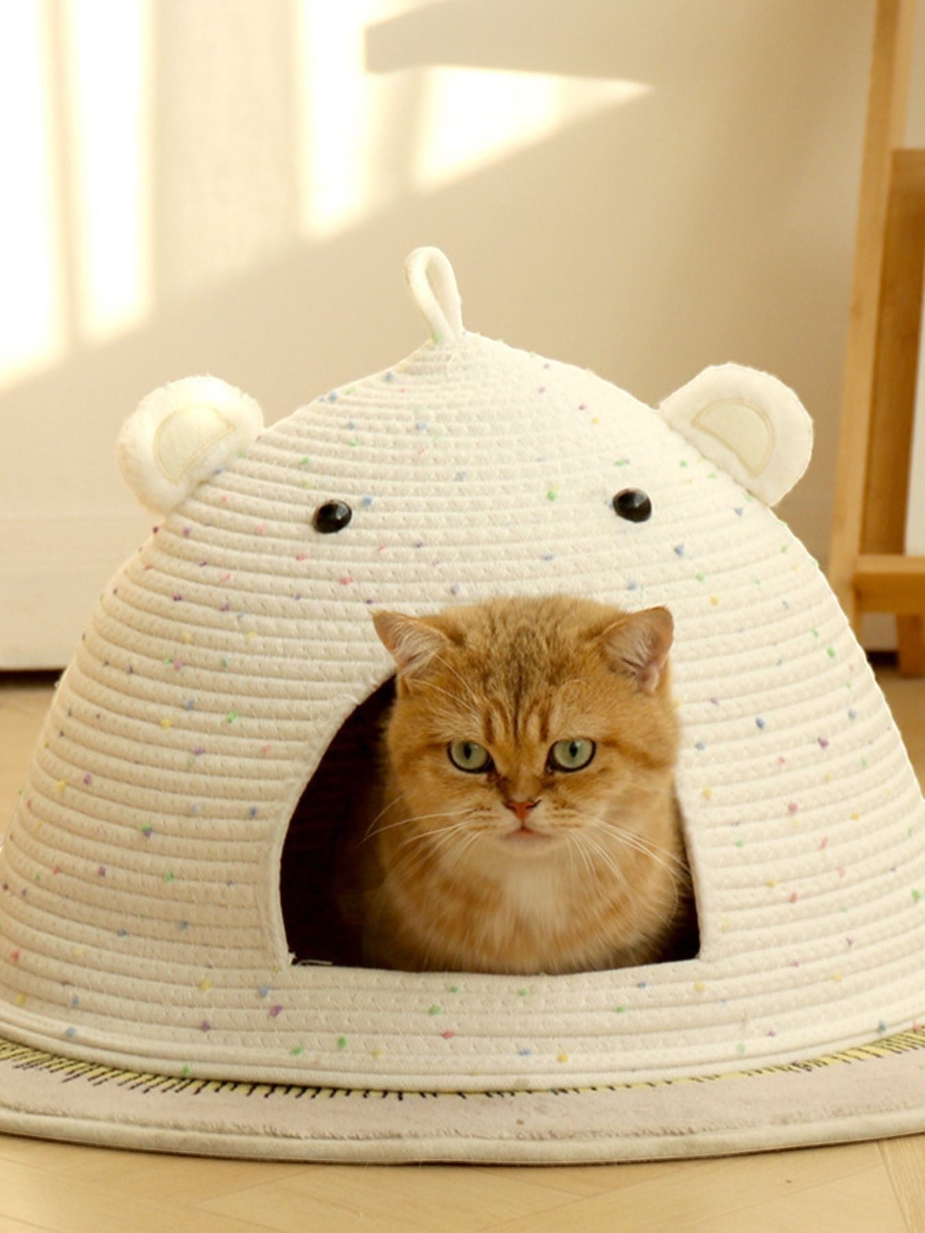 Little Pets Club speckled bear ear cat cave bed made of cotton rope, featuring a cute bear face and ears, with a ginger cat inside.