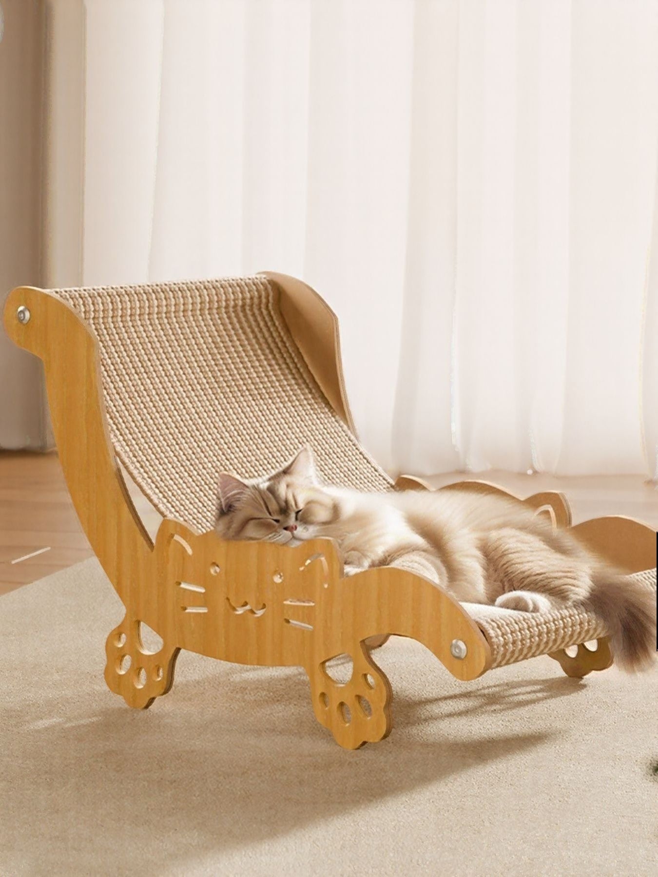 Little Pets Club wooden cat hammock with sisal scratcher, featuring a cute cat face cutout and paw print legs. A fluffy cat sleeps peacefully on the elevated bed.