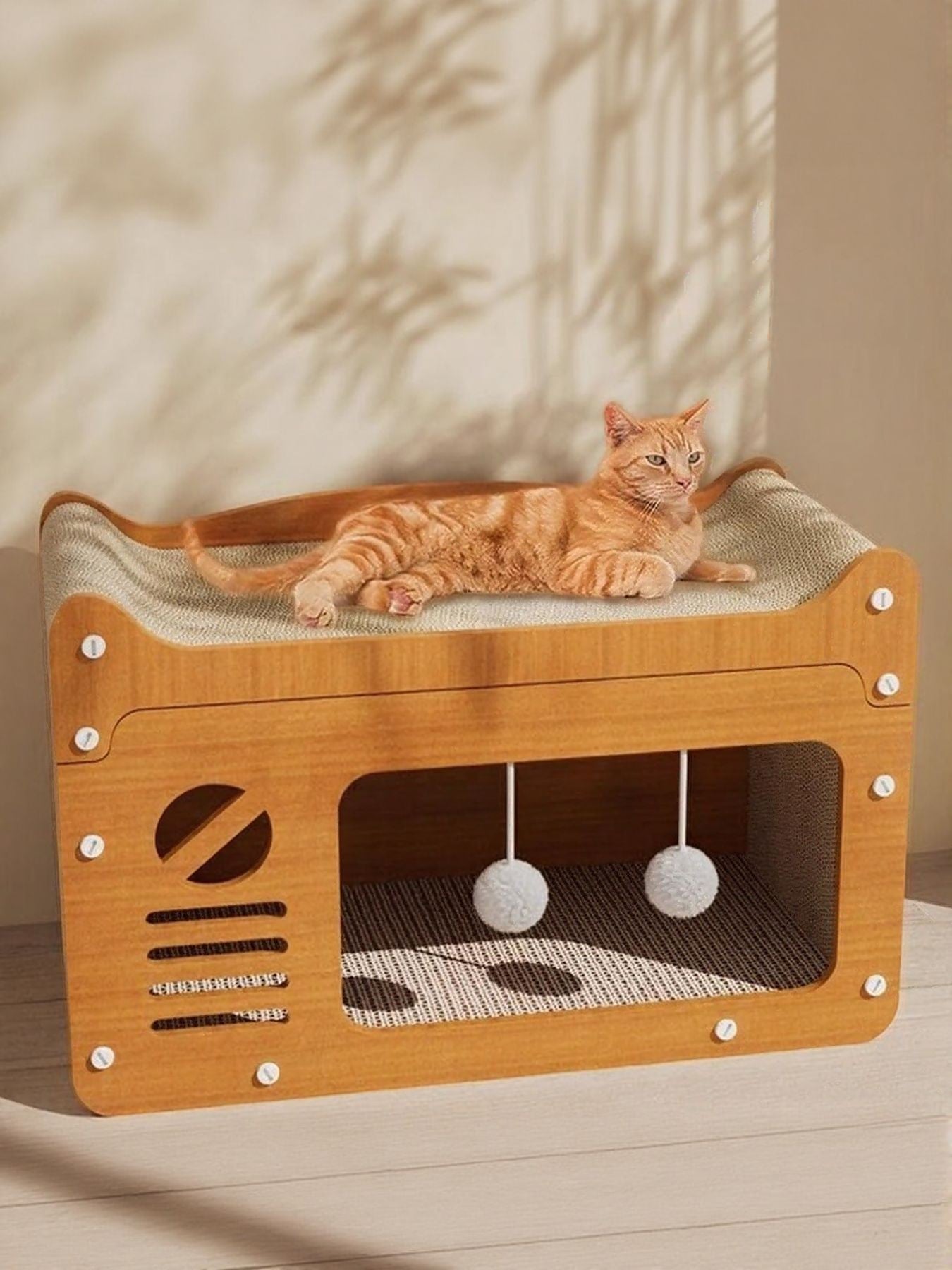 Little Pets Club modern wooden cat scratcher bed with condo and hanging toys. Orange tabby cat lounging on top.