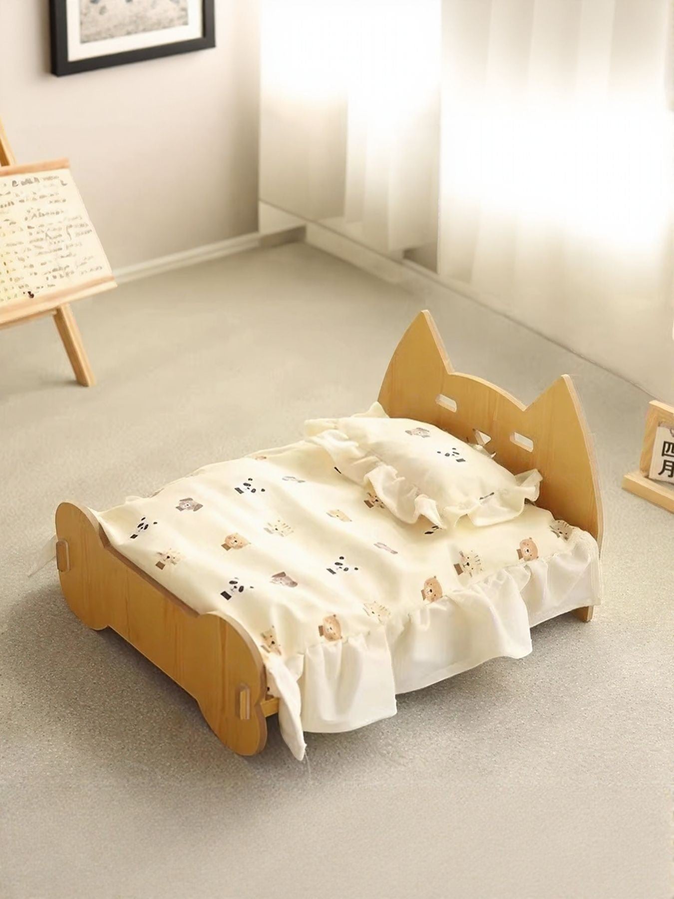 Little Pets Club wooden pet bed with a cute bear and panda print bedding and ruffled trim. Features a natural wood frame with cat-ear headboard.