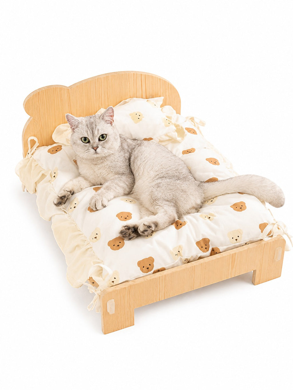 Little Pets Club mini wooden pet bed with a cute teddy bear print cushion and a silver cat lounging on it.