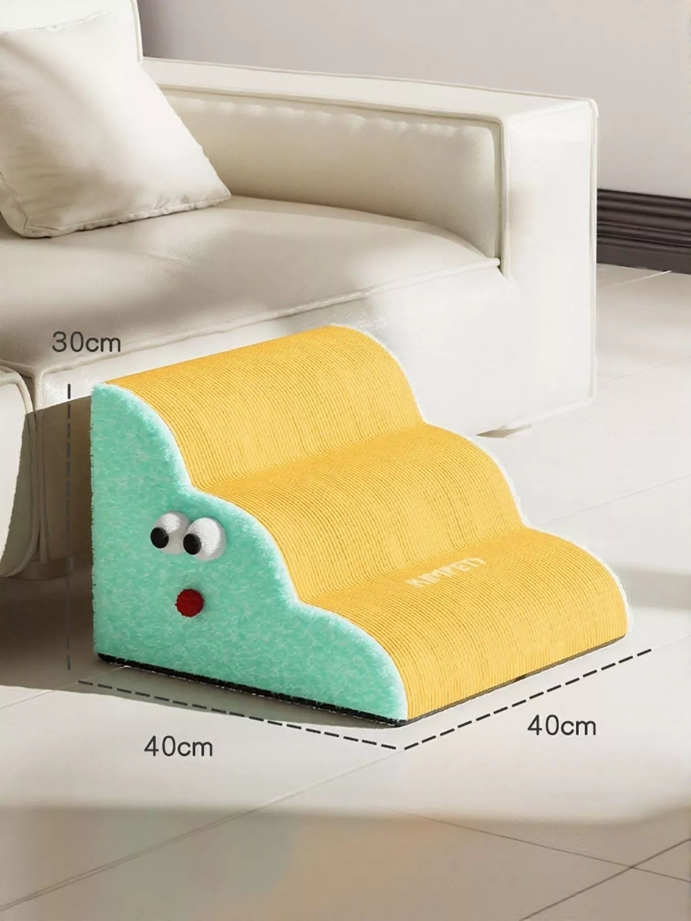 Little Pets Club yellow and mint green three-step pet stairs with googly eyes and red nose, next to a white couch.
