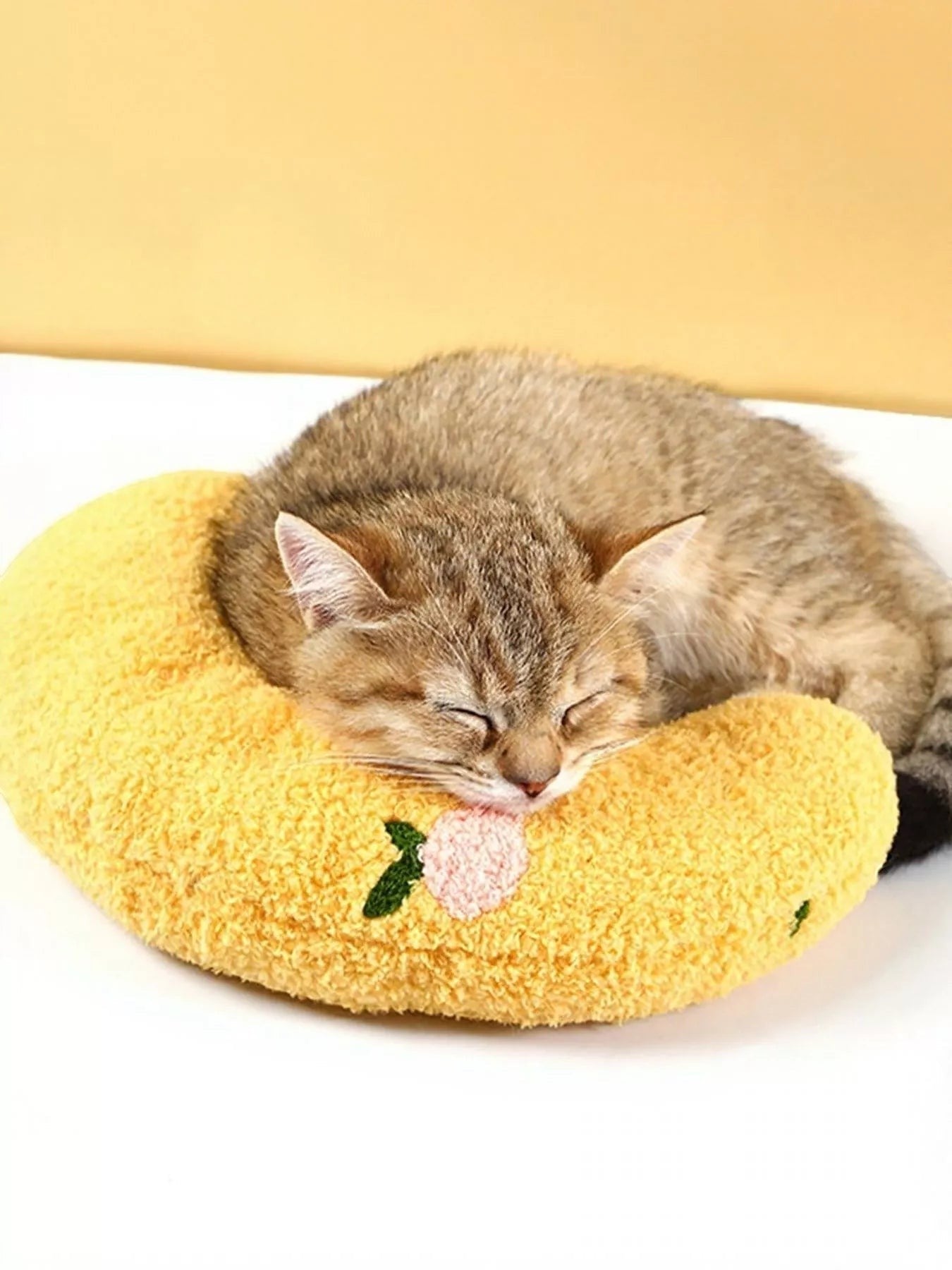 Little Pets Club yellow U-shaped plush pet nest with embroidered peach detail, perfect for cats and small dogs.
