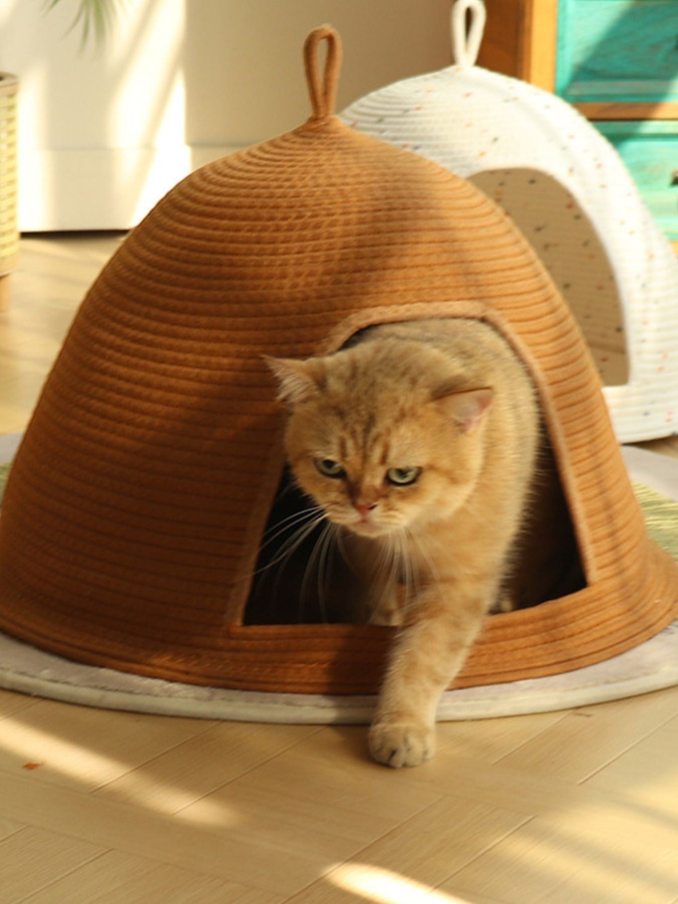 Little Pets Club Cozy Hideaway Cave pet bed in brown woven material, semi-enclosed dome shape with a cat emerging.