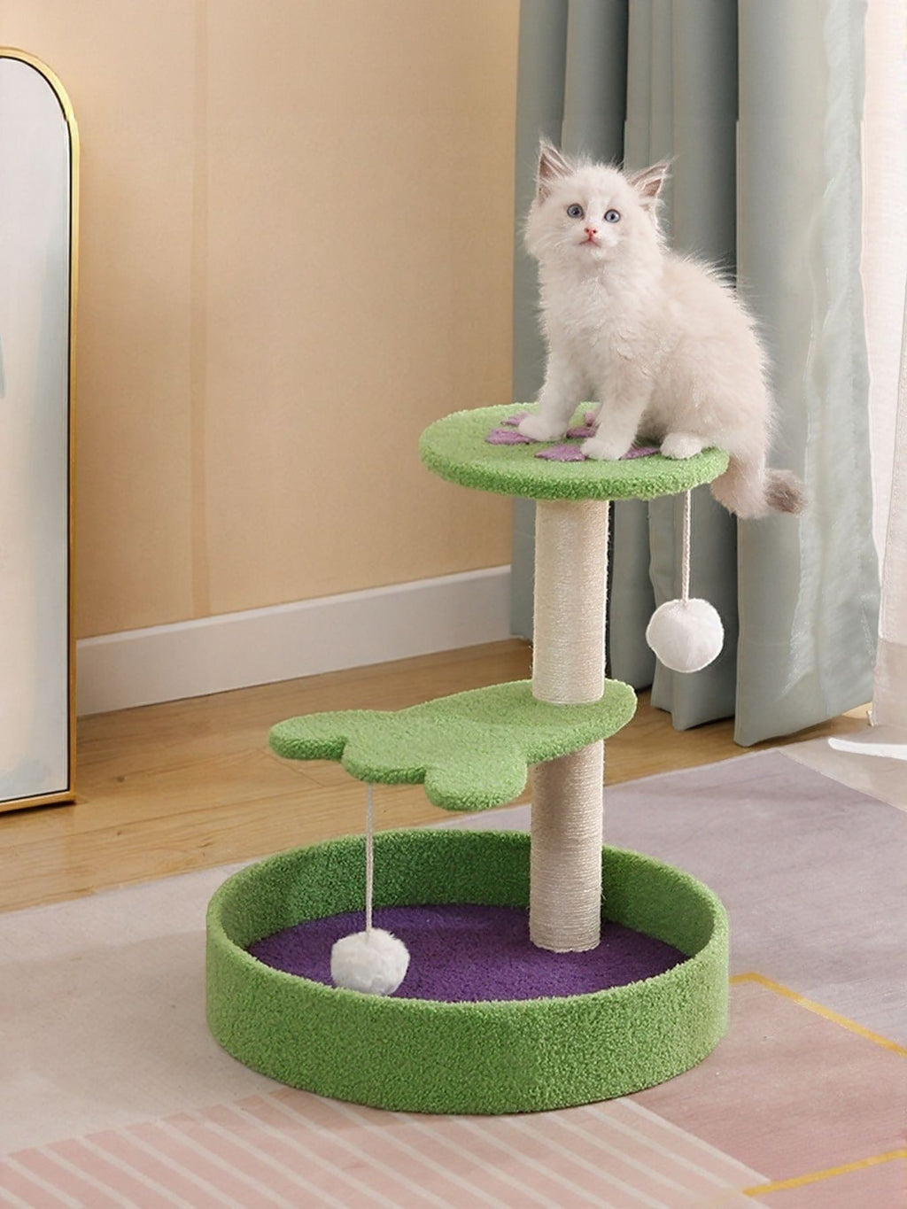 Little Pets Club Playhouse Scratcher cat tree with beige sisal post, green platforms, and purple base bed, featuring a white kitten.