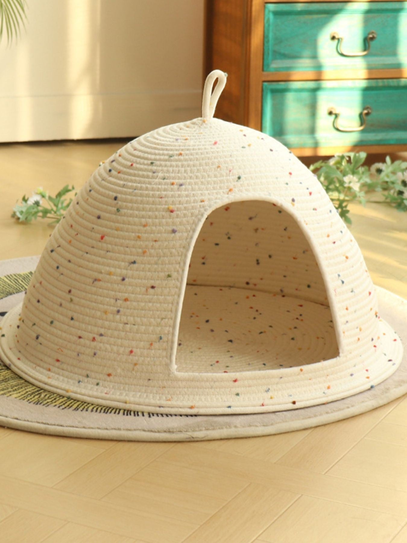 Little Pets Club Cozy Hideaway Cave pet bed, a cream woven dome with colorful speckles and an arched entrance.