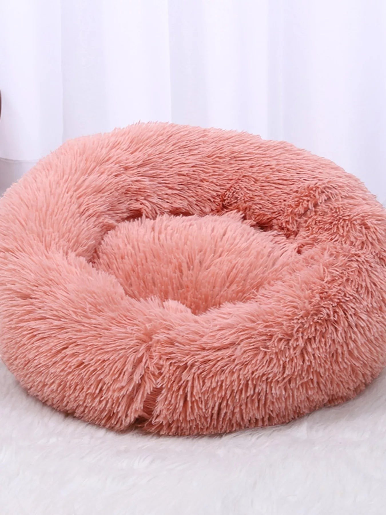 Little Pets Club dusty rose plush donut pet bed with raised edges for comfort and security, faux fur exterior.