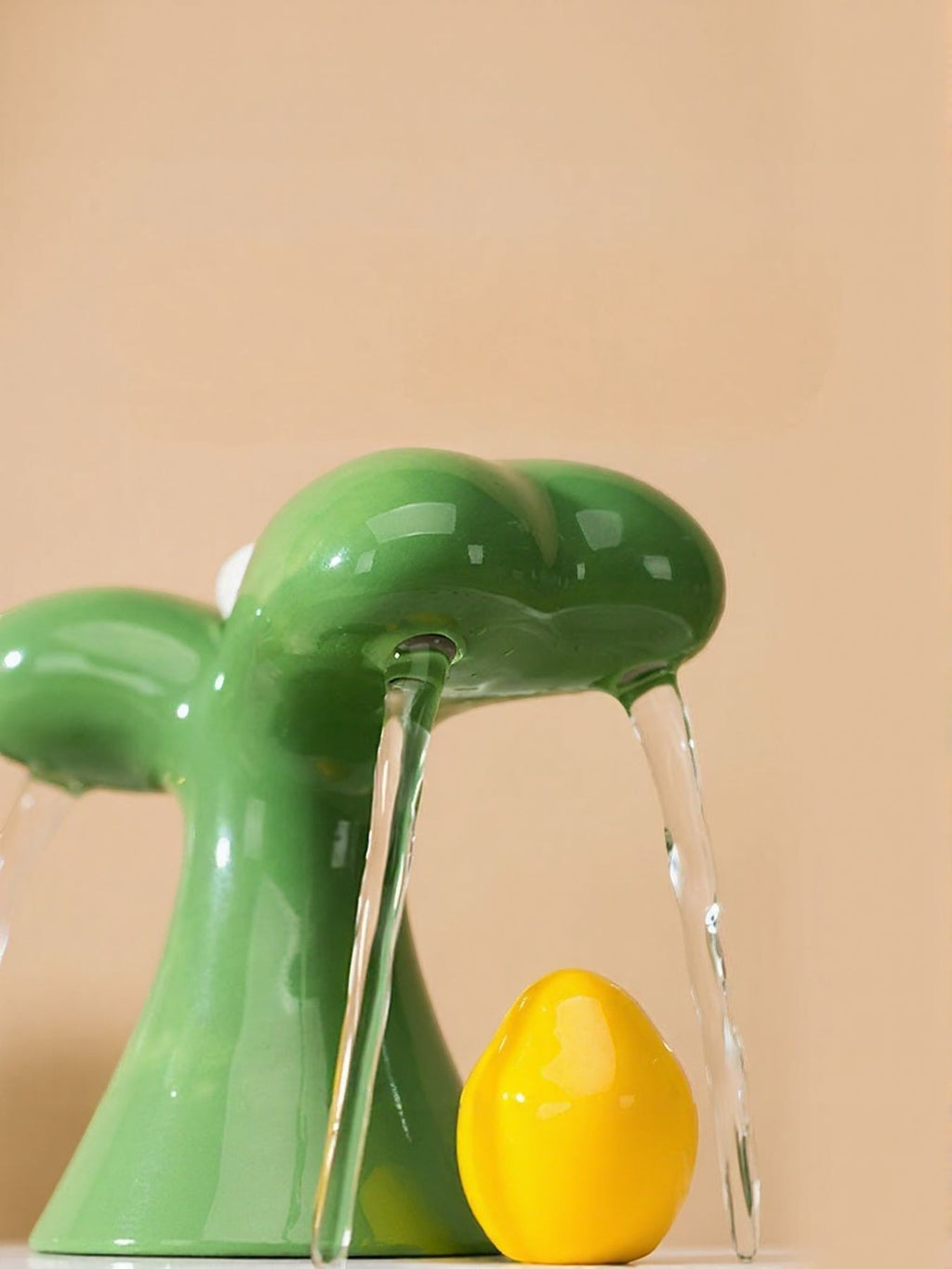 Little Pets Club green ceramic mushroom-shaped pet water fountain with dual streams and a yellow decorative egg.