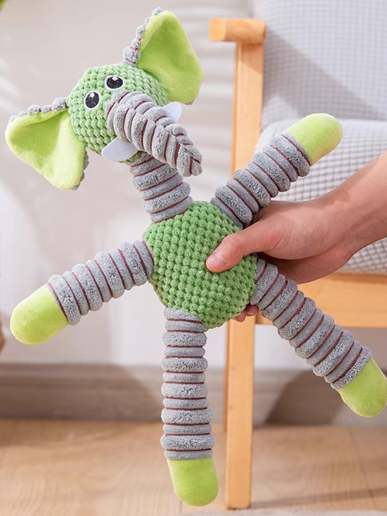 Little Pets Club green plush elephant dog toy with squeaker, polyester material, flexible limbs.