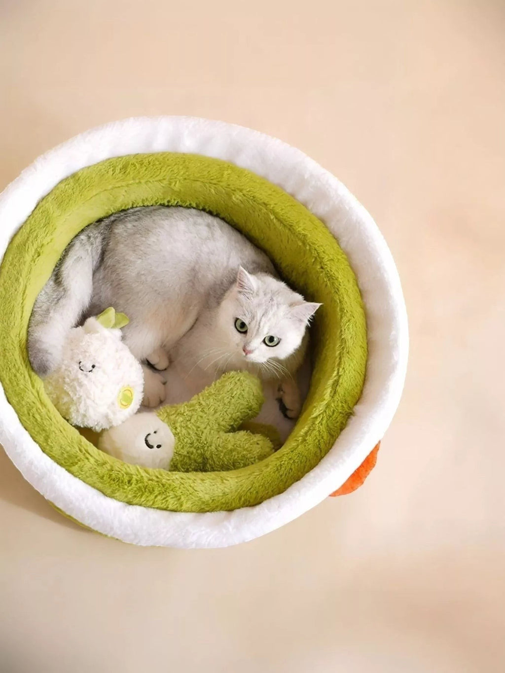 Little Pets Club Cozy Critter Cave plush pet bed in green and white with a white cat inside.