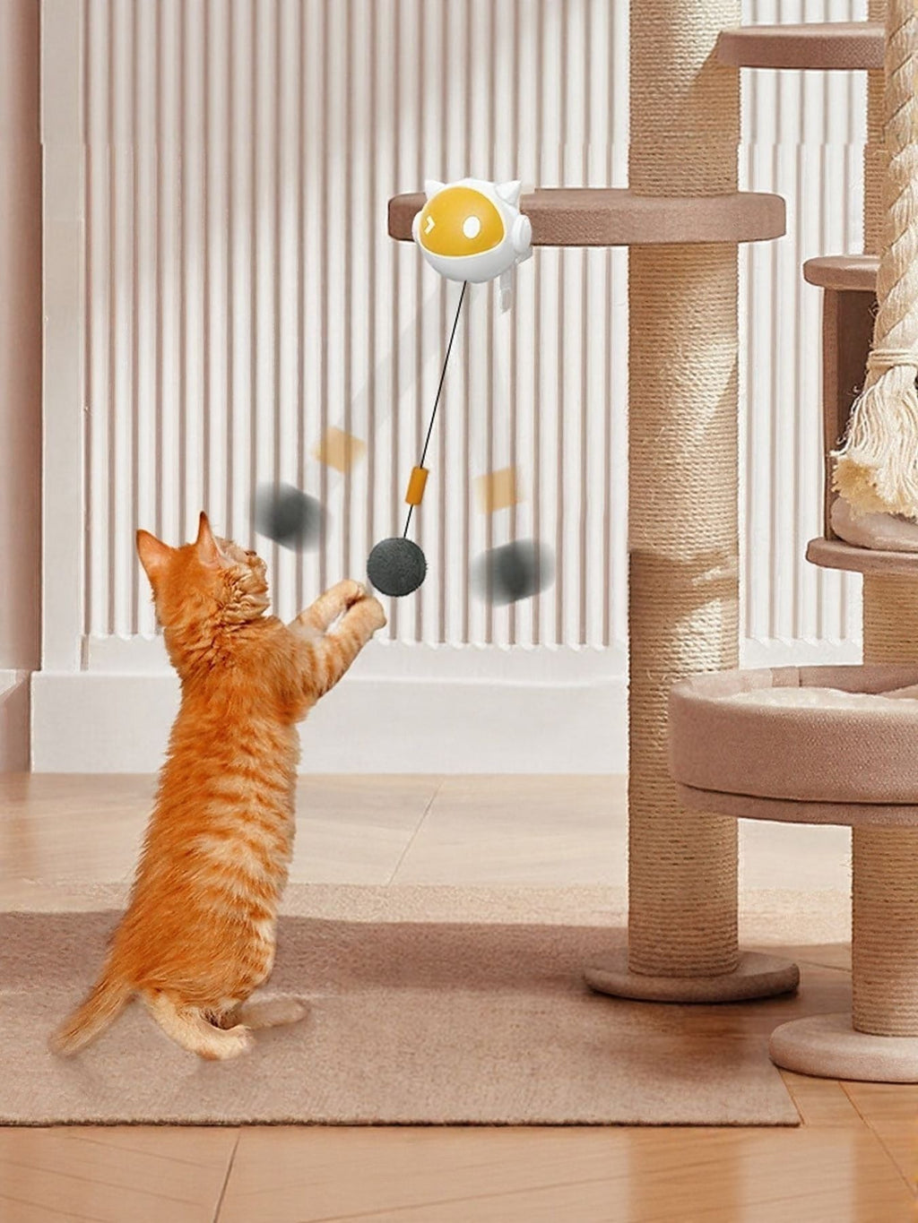 Little Pets Club interactive cat teaser toy with a white and yellow robot head and a grey ball, attached to a cat tree.