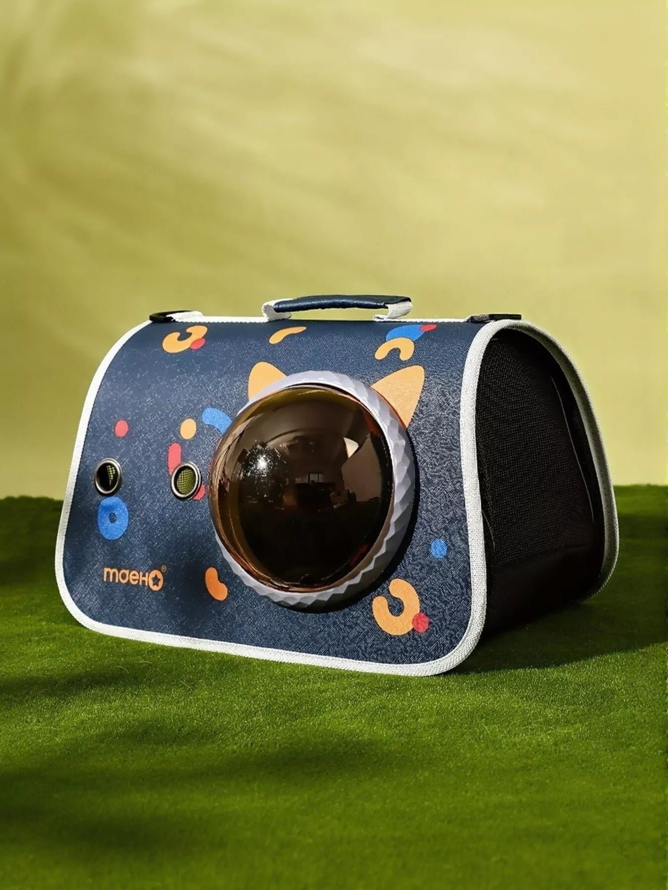 Little Pets Club navy pet carrier with bubble window and colorful graphics. Mesh sides for ventilation.