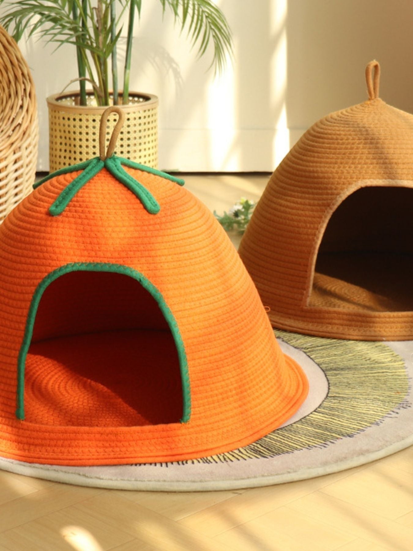 Little Pets Club orange woven pet cave bed with green trim and a loop handle. Semi-enclosed design for security.