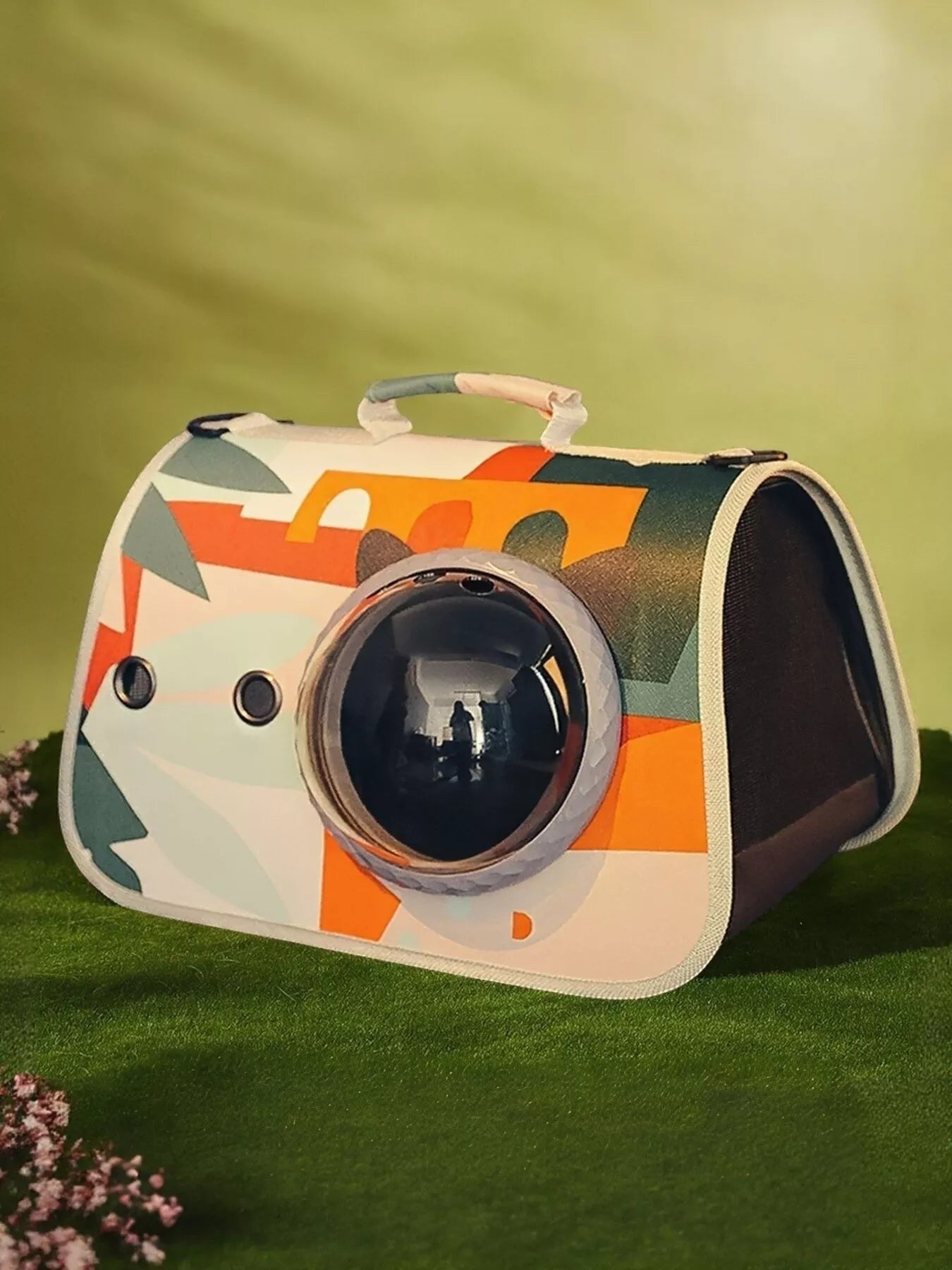 Little Pets Club pet carrier with bubble window, featuring abstract colorful graphics and mesh sides for ventilation. For cats and small dogs.