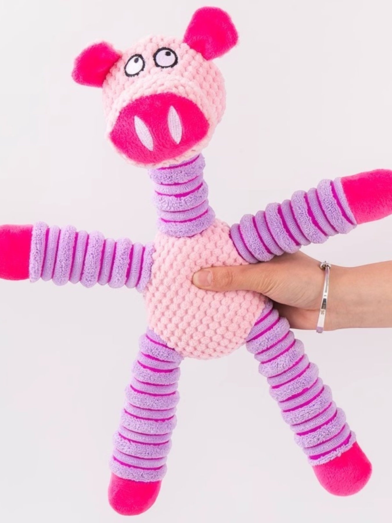 Little Pets Club pink plush pig dog toy with purple striped limbs and squeaker