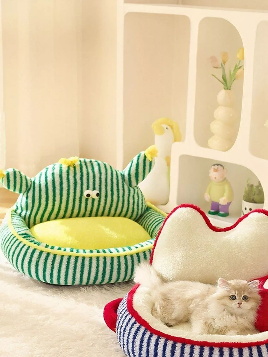 Little Pets Club striped plush cat and dog bed with raised bolster and yellow interior. Features a fun monster design.