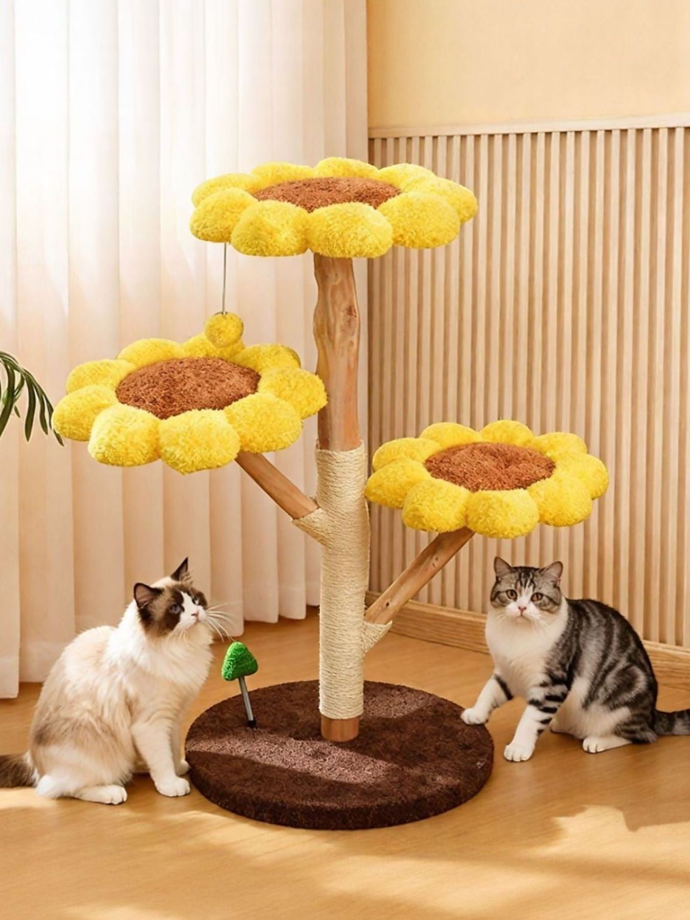 Little Pets Club sunflower cat tree with yellow plush perches and sisal scratching posts. Two cats are near the tree.