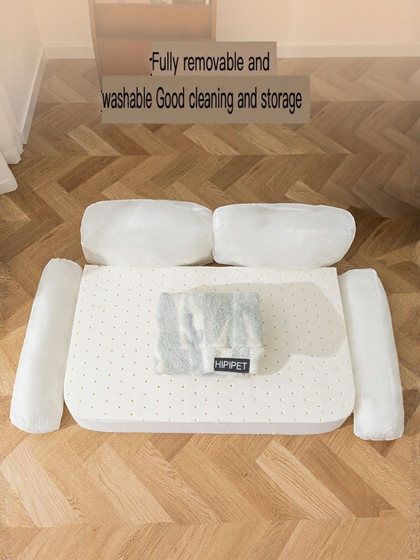 Little Pets Club white plush pet sofa bed with raised bolsters and a small patterned cushion. Fully removable and washable.
