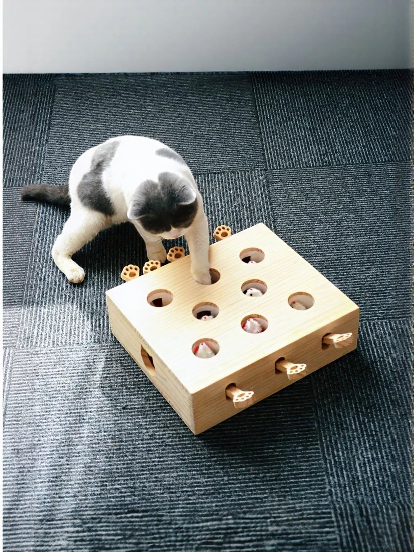 Little Pets Club interactive wooden whack-a-mole toy with a cat playing. Features multiple holes with pop-up characters.